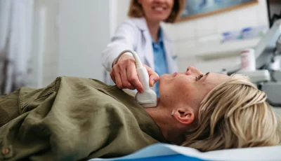 A patient with suspected nodules undergoes a thyroid ultrasound examination.